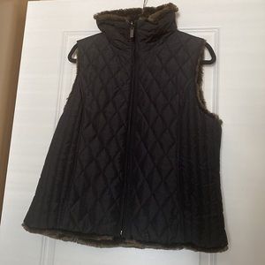 Weatherproof black vest with brown faux fur lining